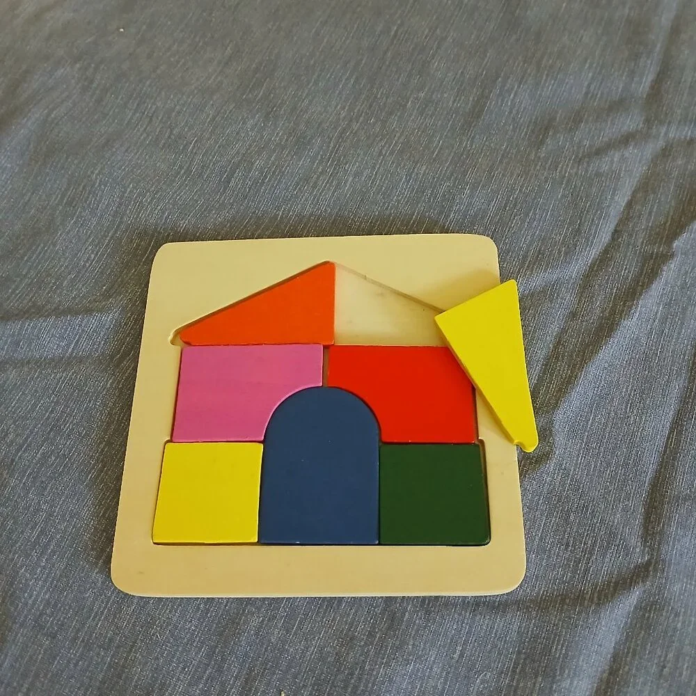 Wooden house puzzle 7 pieces used